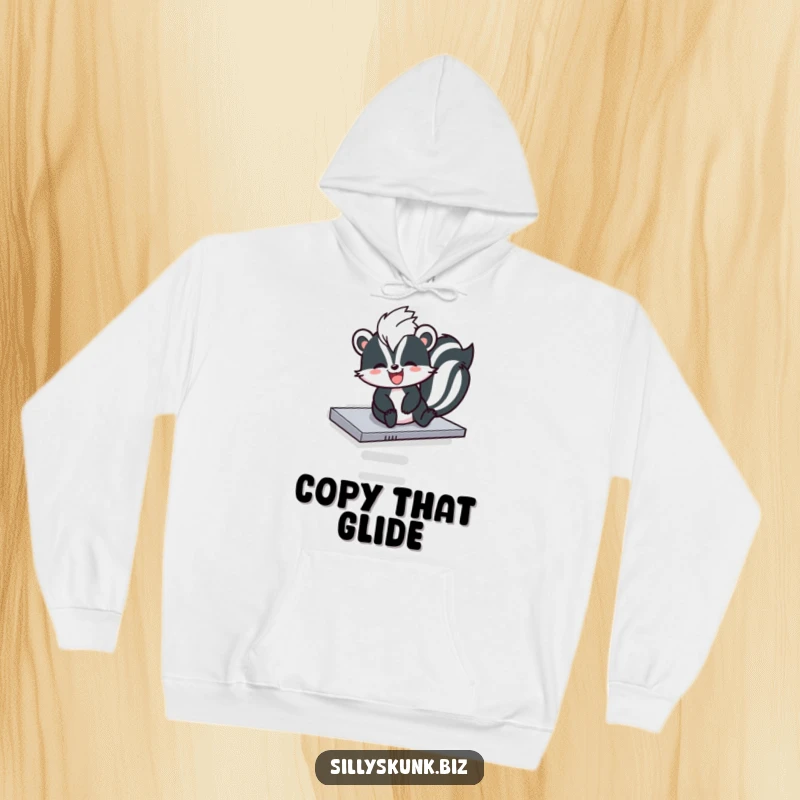 Funny skunk sliding down a photocopier tray with pure glee, on a comfortable humorous hoodie.