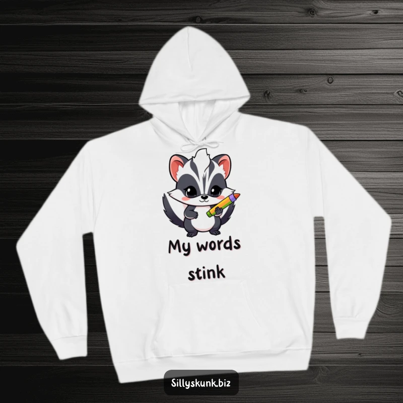 Funny hoodie showing a determined skunk holding a colorful pen, designed for creators seeking comfort and inspiration.