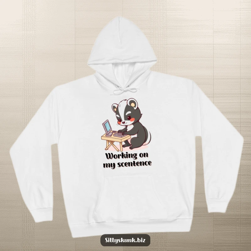 Funny hoodie featuring a cute skunk focused on typing at a miniature desk, offering warmth and office-themed charm.